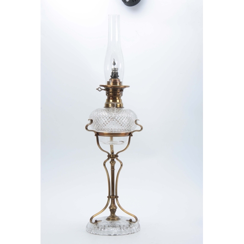 596 - AN ART NOUVEAU BRASS AND CUT GLASS OIL LAMP having unusual hobnail cut vessel with refill plug mount... 