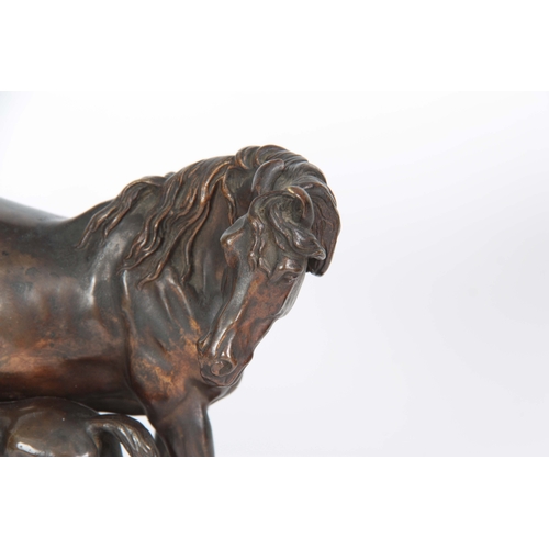 603 - A LATE 19th CENTURY PATINATED BRONZE SCULPTURE modelled as a mare and foal on a naturalistic base 18... 