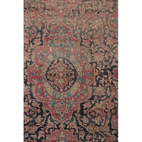 607 - A MULTI-COLOURED 19TH CENTURY PERSIAN RUG with floral border and medallion centre 218 long, 134cm wi... 