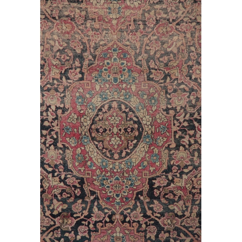 607 - A MULTI-COLOURED 19TH CENTURY PERSIAN RUG with floral border and medallion centre 218 long, 134cm wi... 