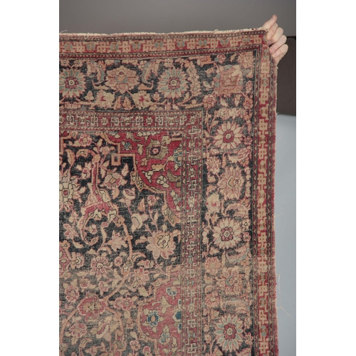 607 - A MULTI-COLOURED 19TH CENTURY PERSIAN RUG with floral border and medallion centre 218 long, 134cm wi... 