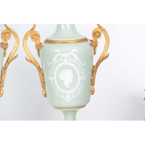 608 - A STYLISH PAIR OF LATE 19TH CENTURY FRENCH CELADON GLAZED PATE SUR PATE AND ORMOLU MOUNTED OIL LAMPS... 