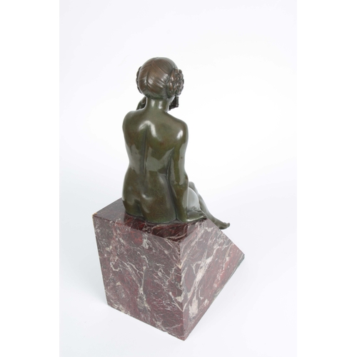 609 - MAURICE GUIRAUD-RIVIERE. A LARGE ART DECO GREEN PATINATED BRONZE SCULPTURE modelled as a seated youn... 