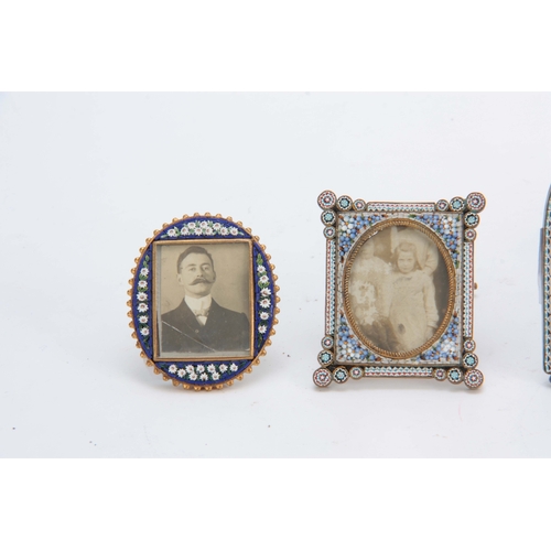 610 - A SET OF FOUR LATE 19TH CENTURY MICRO MOSAIC PICTURE FRAMES decorated with flowers 8cm high and smal... 