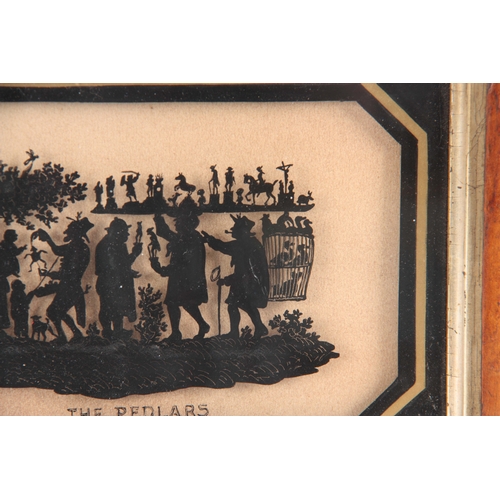 611 - A 19TH CENTURY REVERSE PAINTED SILHOUETTE PICTURE titled 'The Pedlars' gilt-edged black border and B... 