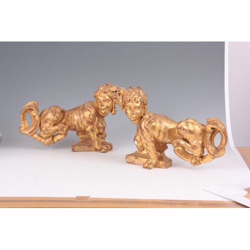 616 - A PAIR OF 18TH CENTURY GILT GESSO PLASTERWORK CHIMERA STATUES 40cm wide 28cm high.