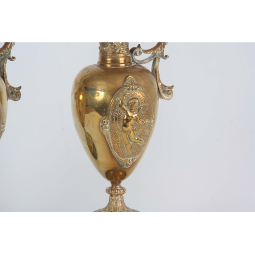 630 - A PAIR OF LATE 19TH CENTURY BRONZE EWERS having shaped spouts and leaf cast handles, with applied re... 