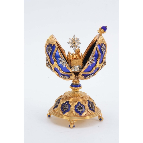 633 - A 20TH CENTURY HOUSE OF FABERGE. THE STAR OF THE NORTH JEWELLED EGG BY THE FRANKLIN MINT gilt silver... 