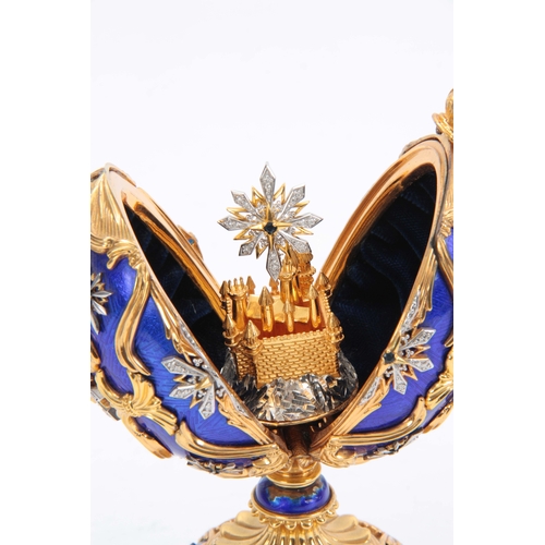 633 - A 20TH CENTURY HOUSE OF FABERGE. THE STAR OF THE NORTH JEWELLED EGG BY THE FRANKLIN MINT gilt silver... 