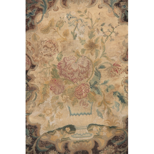 645 - AN 18TH CENTURY EMBROIDERED PANEL depicting flowers 82cm high 63cm wide.