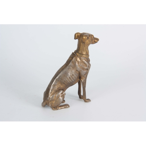 647 - A LATE 19th CENTURY NOVELTY INKWELL modelled as a gilt metal greyhound with amber glass eyes having ... 