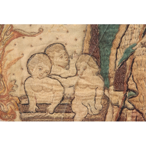 652 - A 17TH CENTURY SILK EMBROIDERED STUMPWORK PANEL depicting a standing Saint with three infants in a b... 