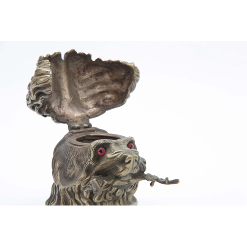 655 - A LATE 19th CENTURY CAST NICKLE NOVELTY INKWELL modelled as a dogs head with red glass eyes and hing... 