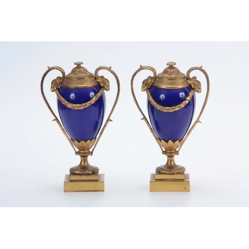 656 - A PAIR OF 19TH CENTURY FRENCH ORMOLU MOUNTED ROYAL BLUE PORCELAIN URN-SHAPED VASES with square stepp... 