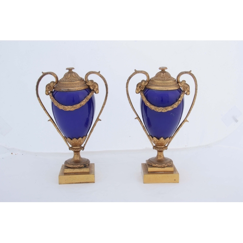 656 - A PAIR OF 19TH CENTURY FRENCH ORMOLU MOUNTED ROYAL BLUE PORCELAIN URN-SHAPED VASES with square stepp... 