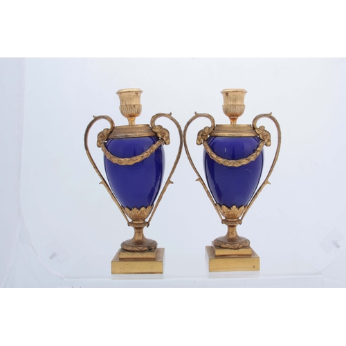 656 - A PAIR OF 19TH CENTURY FRENCH ORMOLU MOUNTED ROYAL BLUE PORCELAIN URN-SHAPED VASES with square stepp... 