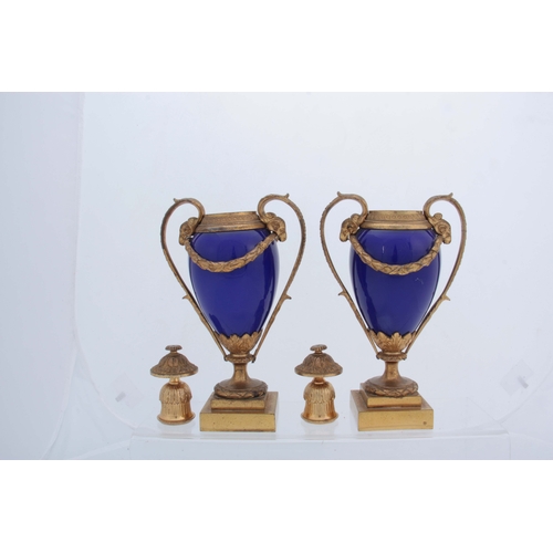 656 - A PAIR OF 19TH CENTURY FRENCH ORMOLU MOUNTED ROYAL BLUE PORCELAIN URN-SHAPED VASES with square stepp... 