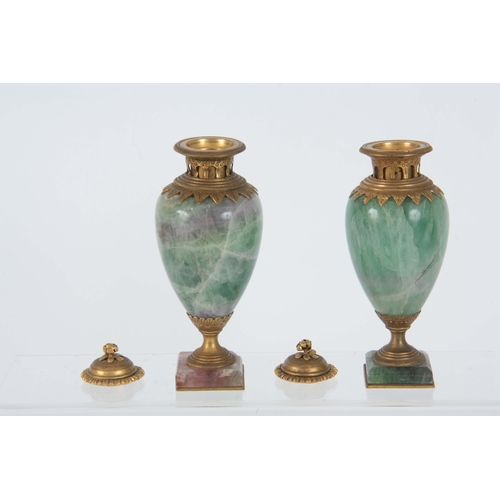 658 - A PAIR OF LATE 19TH CENTURY FRENCH ORMOLU MOUNTED GREEN FELDSPAR LIDDED URNS having colourful veined... 