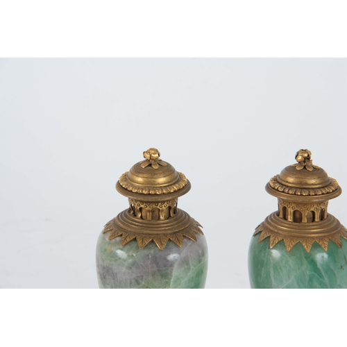 658 - A PAIR OF LATE 19TH CENTURY FRENCH ORMOLU MOUNTED GREEN FELDSPAR LIDDED URNS having colourful veined... 