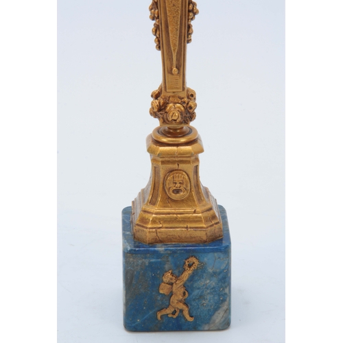 659 - A LATE 19TH CENTURY FRENCH ORMOLU AND LAPIS LAZULI PAPERWEIGHT having a masked scrolled column handl... 