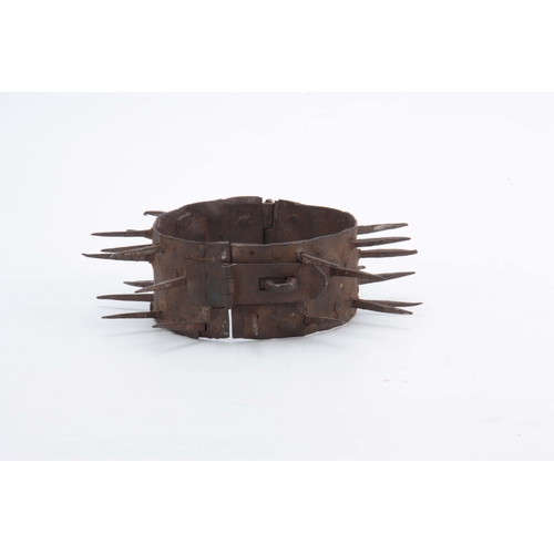 665 - A 19TH CENTURY IRON TURKISH DOG COLLAR having spikes for repelling wolves with a hasp and staple loc... 