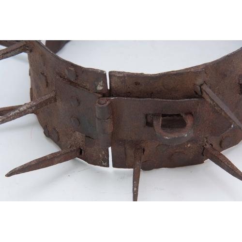 665 - A 19TH CENTURY IRON TURKISH DOG COLLAR having spikes for repelling wolves with a hasp and staple loc... 