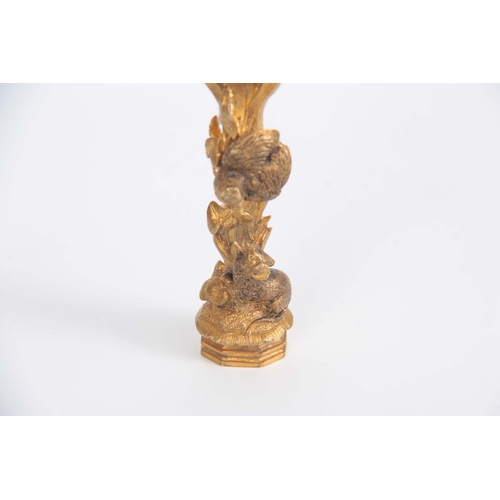 670 - A 19th CENTURY ORMOLU SEAL modelled as two birds nesting with a rat at the base 11cm high