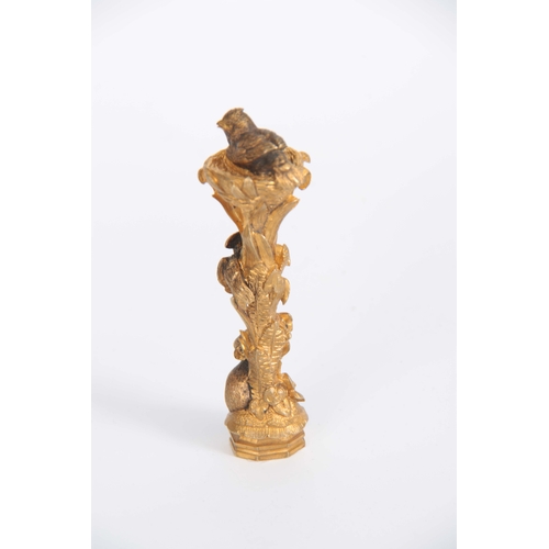 670 - A 19th CENTURY ORMOLU SEAL modelled as two birds nesting with a rat at the base 11cm high