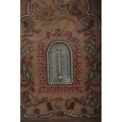 676 - A LATE 19th CENTURY EMBROIDERED TAPESTRY WALL MOUNTED THERMOMETER with beaded border and calibrated ... 