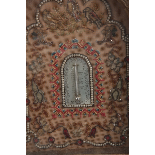 676 - A LATE 19th CENTURY EMBROIDERED TAPESTRY WALL MOUNTED THERMOMETER with beaded border and calibrated ... 