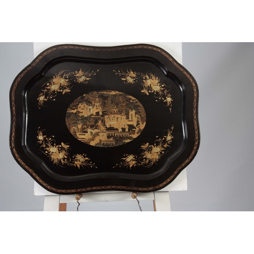 680 - A 19TH CENTURY SCALLOPED BLACK LACQUER AND CHINOISERIE DECORATED PAPIER MACHE TRAY with central dome... 