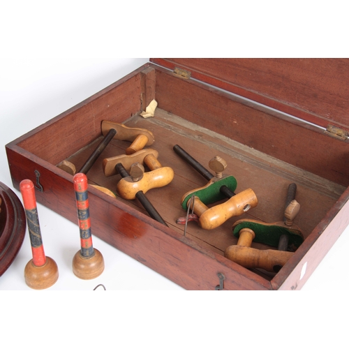 687 - A COMPLETE LATE 19th CENTURY TABLE CROQUET GAME having eight box wood mallets, and balls on a turned... 