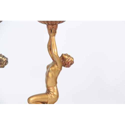 690 - TWO 20TH CENTURY ART DECO PATINATED SPELTER FIGURAL LAMPS in the manor of Lorenzl having gold patina... 