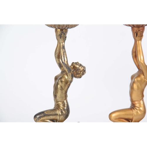 690 - TWO 20TH CENTURY ART DECO PATINATED SPELTER FIGURAL LAMPS in the manor of Lorenzl having gold patina... 