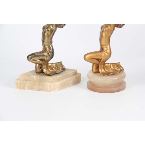 690 - TWO 20TH CENTURY ART DECO PATINATED SPELTER FIGURAL LAMPS in the manor of Lorenzl having gold patina... 