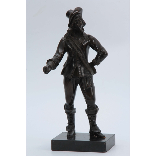 699 - A LATE 19th CENTURY PATINATED BRONZE FIGURE modelled as a standing cavalier mounted on black marble ... 