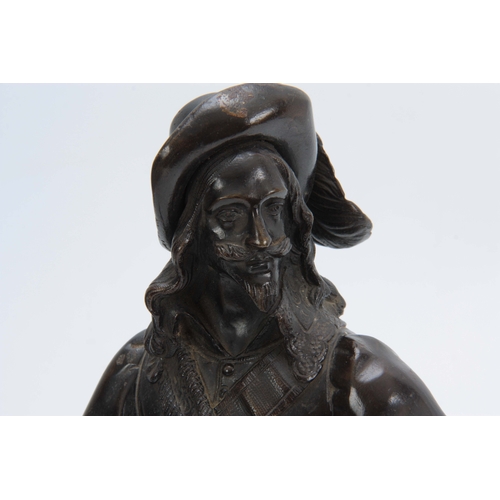 699 - A LATE 19th CENTURY PATINATED BRONZE FIGURE modelled as a standing cavalier mounted on black marble ... 