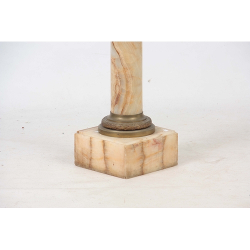 707 - A LATE 19TH CENTURY ONYX MARBLE COLUMN with revolving top, gilt brass collar and stepped base 102cm ... 