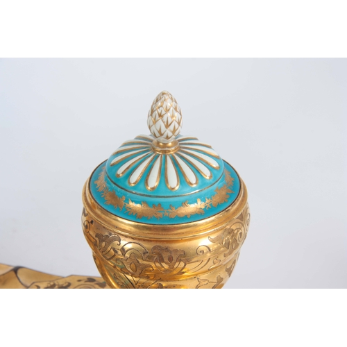 715 - A 19TH CENTURY SERVES PORCELAIN MOUNTED ORMOLU INKWELL / DESK STAND inset with a painted porcelain p... 