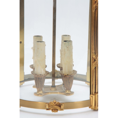 722 - A 20TH CENTURY BRASS REGENCY STYLE CIRCULAR HANGING HALL LANTERN 53cm high 30cm diameter.