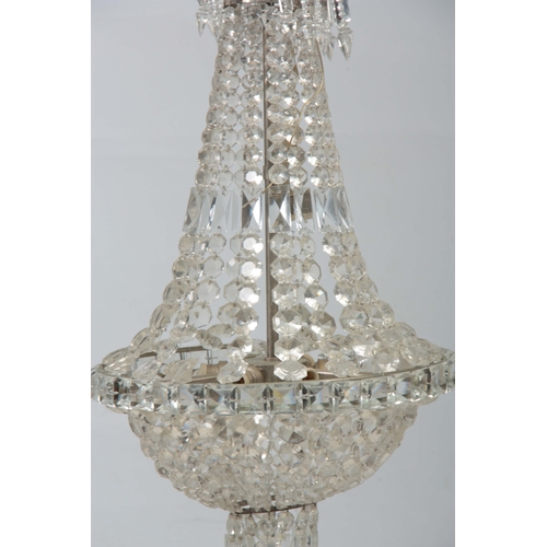 723 - A 20TH CENTURY CUT GLASS CHANDELIER of circular form with draping sides and domed base 68cm high.