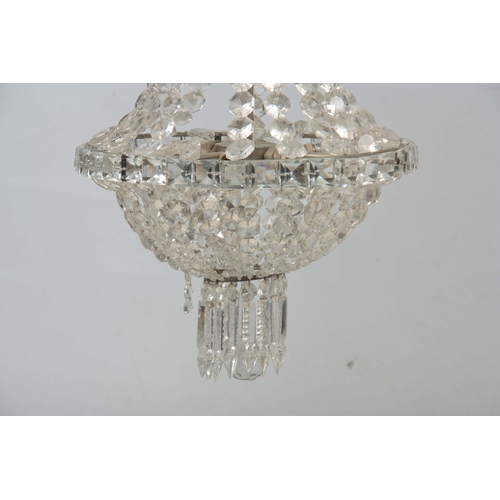 723 - A 20TH CENTURY CUT GLASS CHANDELIER of circular form with draping sides and domed base 68cm high.