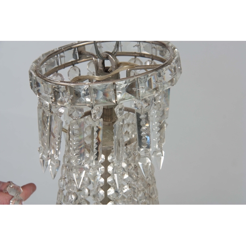 723 - A 20TH CENTURY CUT GLASS CHANDELIER of circular form with draping sides and domed base 68cm high.