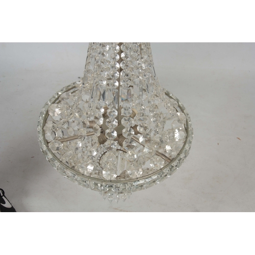 723 - A 20TH CENTURY CUT GLASS CHANDELIER of circular form with draping sides and domed base 68cm high.