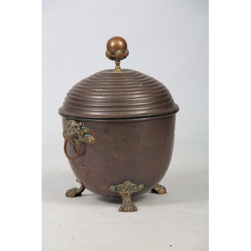 739 - A 19TH CENTURY REGENCY COPPER AND BRASS LIDDED COAL BUCKET having looped lion mask handles, lion paw... 