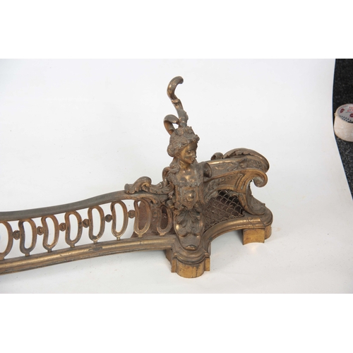 746 - A 19TH CENTURY FRENCH ROCOCO STLE GILT BRONZE SERPENTINE HEARTH FENDER with figural ends joined by a... 