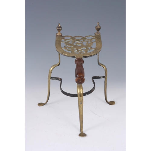 749 - A LATE GEORGIAN ENGRAVED BRASS HEARTH STAND with horseshoe-shaped cut-out top, centre bird moti... 