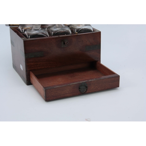 757 - AN EARLY 19th CENTURY BRASS BOUND MAHOGANY APOTHECARY BOX the locking hinged lid with sunken brass h... 