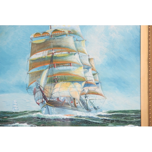 837 - H W MOORE OIL ON BOARD depicting two galleons in full sail - signed dated 1935, mounted in a glazed ... 