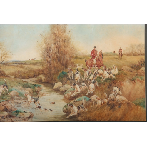 850 - A 19TH CENTURY WATERCOLOUR River landscape scene with huntsmen on horseback with a pack of foxhounds... 